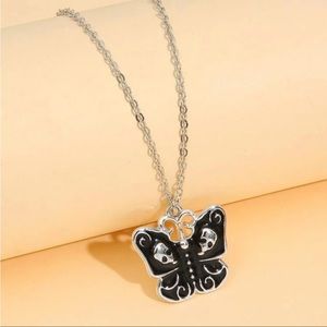 NWOT Black skull wing butterfly necklace